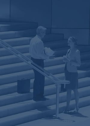 Two insurance specialists meet outside before parting ways