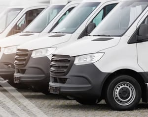 Commercial vans parked in a line