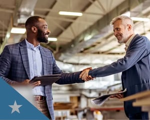 Two professionals shake hands